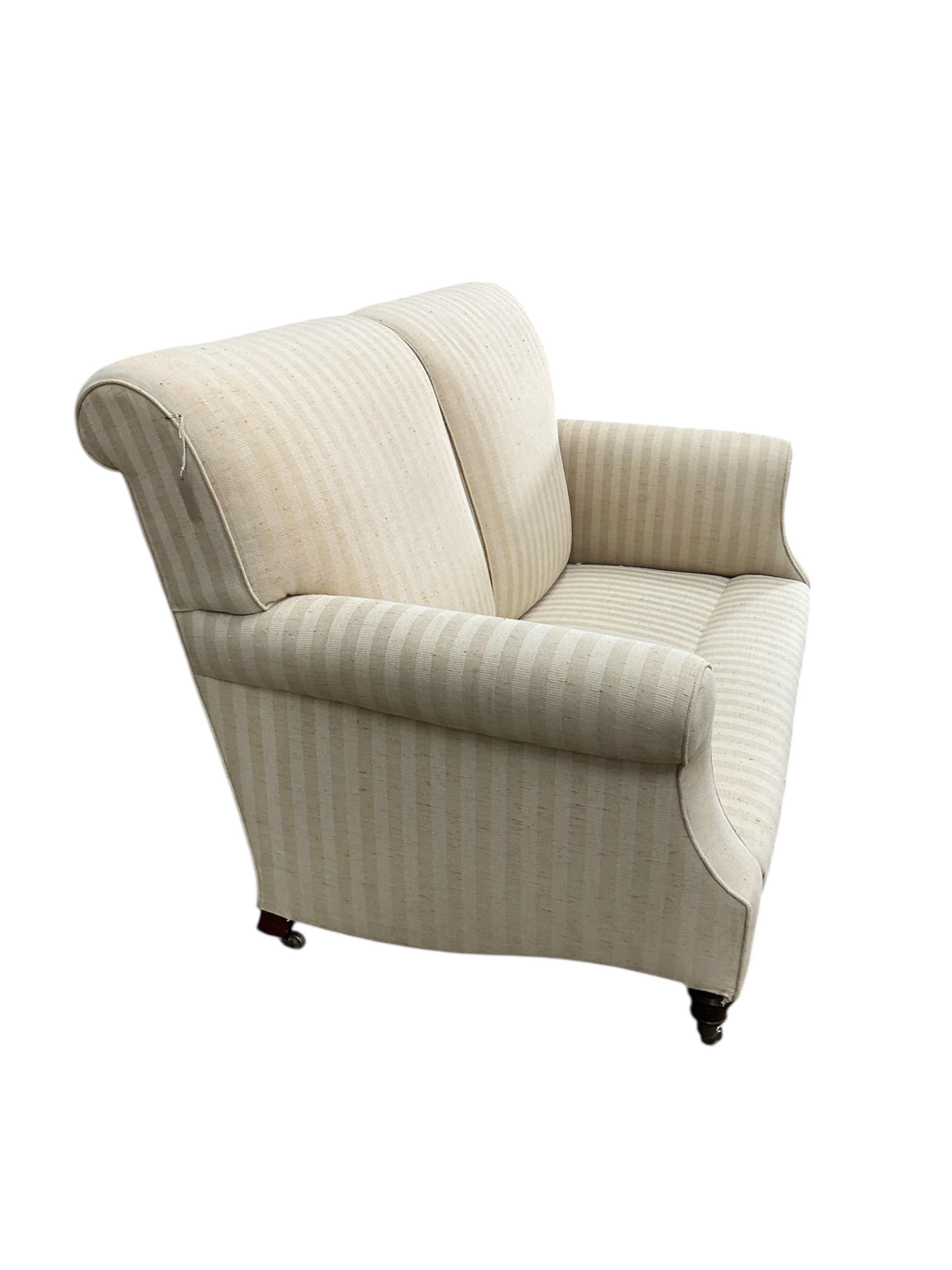 A Victorian style upholstered scroll arm two seater settee, width 150cm, depth 76cm, height 92cm